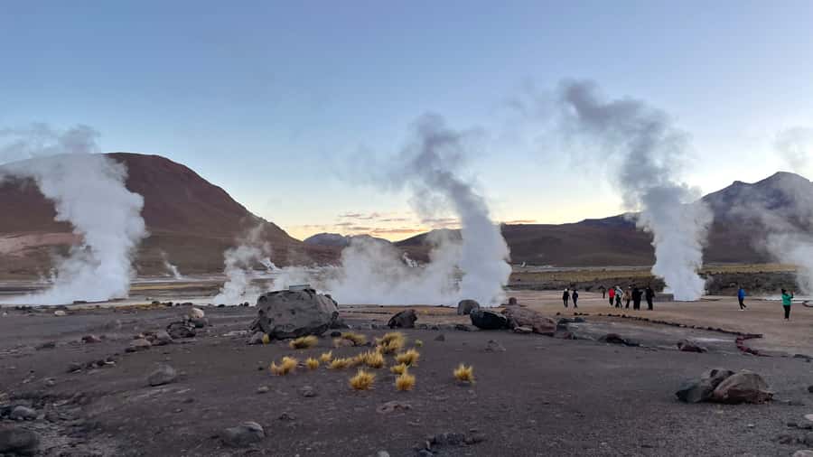 From San Pedro de Atacama: Tatio Geysers and Machuca Tour - Putana wetland and volcano views