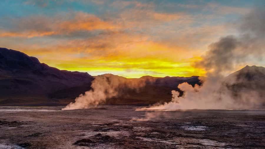 San Pedro de Atacama: El Tatio Geysers & Machuca Lagoon Trip - Walking among more than 100 steaming craters